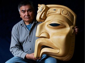 Dempsey Bob poses with his carving Eagles from the North. In 2013 Dempsey Bob was appointed an Officer of the Order of Canada and is now a senior adviser at the Freda Diesing School of Northwest Coast Art in Terrace.