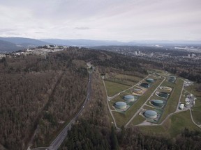 Kinder Morgan Trans Mountain Expansion Project's oil storage tank farm, at right with green tanks, is seen in Burnaby, B.C., on Friday, Nov. 25, 2016. Desjardins are ending their moratorium on pipeline lending and will continue to support the Trans Mountain pipeline expansion.