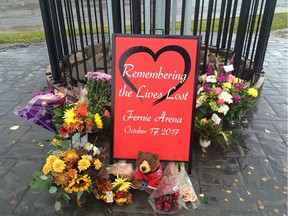 A memorial is seen outside of City Hall in Fernie, B.C. on Friday, October 20, 2017. The City of Fernie, B.C., shut down its operations Friday to give staff time to grieve the deaths of co-workers following an ammonia leak at the local ice rink. The provincial coroners service said the men who died were Fernie residents Wayne Hornquist, 59, and Lloyd Smith, 52, and 46-year-old Jason Podloski of Turner Valley, Alta.