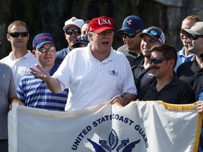 President Donald Trump speaks as he meets with members of the U.S. Coast Guard, who he invited to play golf, at Trump International Golf Club, Friday, Dec. 29, 2017, in West Palm Beach, Fla.