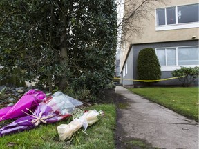 Flowers left at crime scene at the Haro Apartments in Victoria, B.C. December  27, 2017.
