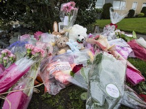 Flowers and teddy bears have been left at the site of a Christmas Day double homicide at the Haro Apartments in Oak Bay.