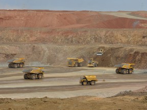 A new report from a Dutch non-profit group alleges Vancouver-based Turquoise Hill Resources Ltd. has avoided paying hundreds of millions of dollars in Canadian taxes on its Mongolian mine. This photo taken on June 23, 2012 shows mining work at the open pit section of the Oyu Tolgoi gold and copper mine which is operated by Rio Tinto.