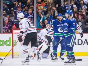 Sam Gagner, second right, celebrates his first of two goals against the Blackhawks.