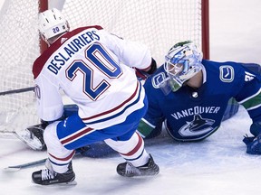 Nicolas Deslauriers scores on Anders Nilsson during a three-goal second period for Montreal.
