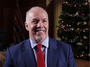 Premier John Horgan poses for a portrait following a year end interview at his office at Legislature in Victoria, B.C., on Tuesday, December 12, 2017.