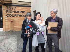 The parents, wife and child of cyclist Bradley Dean outside Richmond Courthouse on Wednesday. Shown are Bradley Dean's mother Lianne, wife Adele holding their daughter Amaurie, and father Tom.