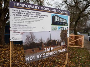 A judge has dismissed an appeal from a group of Marpole residents frustrated by the city's plans to build temporary modular housing in the neighbourhood. In this December 2017 photo, a banner placed by protesters can be seen on a city sign at the Marpole site where the housing will be constructed.