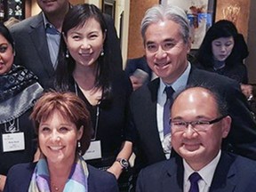 Loretta and Paul Oei stand behind then premier Christy Clark and MLA John Yap at a B.C. Liberal event in 2015.