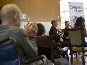 Residents at the Carleton Gardens senior home in Burnaby, BC listen to a performance by Borealis String Quartet during a Concerts in Care performance Friday, September 22, 2017.