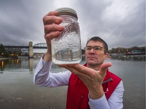 Peter Ross, vice-president of research at Ocean Wise Conservation Association, inspects water samples just taken at Sunset Beach in Vancouver.