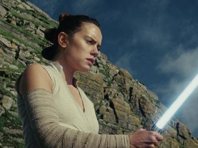 This image released by Lucasfilm shows Daisy Ridley as Rey in "Star Wars: The Last Jedi," in theaters on Dec. 15. (Lucasfilm via AP)