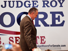 U.S. Senate candidate Roy Moore leaves the stage after giving a speech at the end of an election-night watch party, Tuesday, Dec. 12, 2017, in Montgomery, Alabama.
