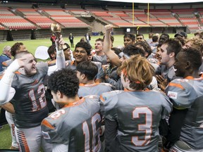 New Westminster Hyacks players celebrate their Subway Bowl Triple-A football championship win over the Terry Fox Ravens at B.C. Place Stadium on Saturday, Dec. 2, 2017. The Hyacks scored a touchdown on the final play of the game — then successfully went for a two-point convert — to win 15-14.