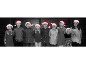From left, Andie Anderson, Liam Sutton, Evan Cook, Abigail Hecht, Conlan Ceraldi, Matthew Lopes, Mia Stevens, Rowan Shook and Isabella Dias recreate their 2007 Christmas baby photo.