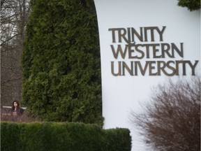 A student leaves Trinity Western University in Langley, B.C., on Wednesday, February 22, 2017.