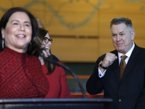 Tim Leiweke pumps his fist in reaction to remarks by Seattle City Council member Debora Juarez before Leiweke signed an agreement to renovate KeyArena with Mayor Jenny Durkan on Wednesday in Seattle.