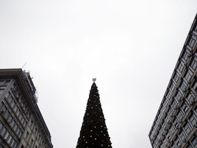 The Belgrade's official Christmas tree decorated with city coat of arms stands in main pedestrian street in downtown Belgrade, Serbia, Friday, Dec. 22, 2017. The city authorities in Serbia's capital are facing outrage over the purchase of a plastic Christmas tree that reportedly cost euro83,000  ($98,000). An anti-corruption website has described the 18-meter (59-feet) Christmas tree as the most expensive in the world, comparing it with that outside the Rockefeller Center in New York and other major world cities.