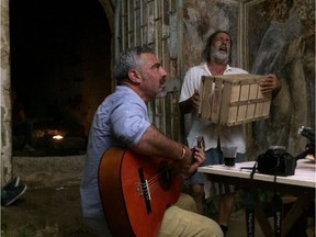 Art restorer Tonio Creanza and storyteller Donato Emar Orante in Shepherds in the Cave, which screens Jan. 7 as part of the Italian Film Festival.