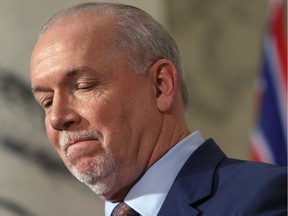Premier John Horgan  after giving the green light on continuing construction on the controversial Site C Dam project during a press conference in Victoria, B.C., on Monday, December 11, 2017.