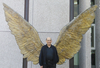 Comically, early gay liberation activist Stan Persky wonders if Pride now has to ban ‘uniform fetishists’ from marching. (Photo: Persky in front of the ‘Wings of Mexico’ at the Embassy of Mexico, Berlin)