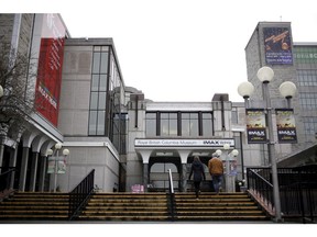 People walk up stairs to the entrance of the Royal B.C. Museum in Victoria in December 2017.