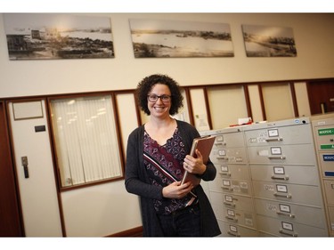 Genevieve Weber works as an archivist in the BC Archives room where the public can view moments in the province's history at the Royal BC Museum in Victoria, B.C., on Thursday, December 21, 2017.