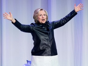 Hillary Clinton waves to the audience at the end of a book tour event in Vancouver, B.C., on Wednesday December 13, 2017.