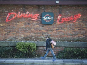 The White Spot restaurant site on West Georgia Street in Vancouver and the adjacent parking lot to the east, in foreground, have been sold for $245 million to a Hong Kong developer.