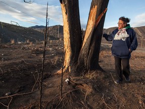 Angie Thorne stands where her house once stood on the Ashcroft Indian Reserve, B.C., on Monday November 27, 2017. Little remains of the wreckage from Angie Thorne's home after a wildfire tore through her reserve in central British Columbia earlier this year.