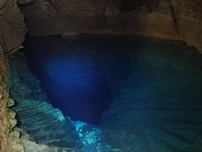 A water table at -655m is seen inside the cave.