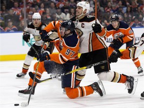 Edmonton Oilers captain Connor McDavid battles Anaheim Ducks counterpart Ryan Getzlaf during NHL action at Rogers Place in Edmonton on Jan. 4, 2018.