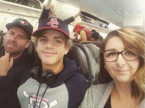 Kyle Losse is flanked by parents Brian and Niki Losse.