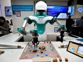 An intelligent vision robot plays Scrabble at the Industrial Technology Research Institute booth during CES 2018 at the Las Vegas Convention Center on January 10, 2018 in Las Vegas, Nevada.