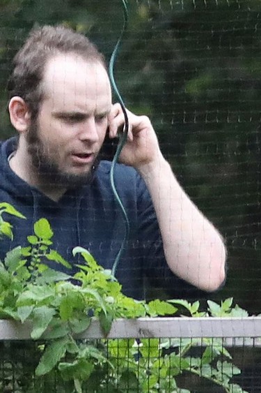Joshua Boyle talks on a cellphone outside the Boyle family home in Smiths Falls, Ont., in October 2017.