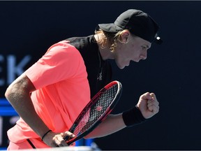 Canada's Denis Shapovalov reacts after a point against Greece's Stefanos Tsitsipas during their men's singles first round match on day one of the Australian Open tennis tournament in Melbourne on January 15, 2018.