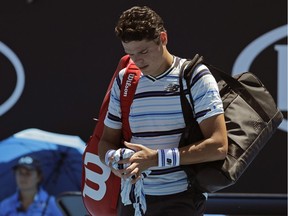 Canada's Milos Raonic leaves the court following his first round loss to Slovakia's Lukas Lacko at the Australian Open tennis championships in Melbourne, Australia, Tuesday, Jan. 16, 2018.