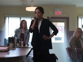 Kristin Kreuk (centre) in a scene from the new CBC drama‚ Burden of Truth.