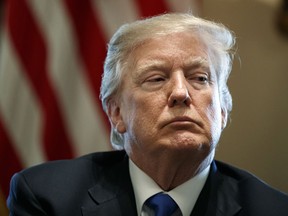 In this Tuesday, Jan. 9, 2018 file photo, President Donald Trump listens during a meeting with lawmakers on immigration policy in the Cabinet Room of the White House in Washington.