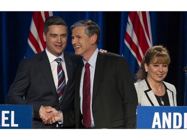 Left-right: Todd Stone and Andrew Wilkinson shake hands as , Dianne Watts walks past after the BC Liberal leadership debate at the Weston Bayshore, Jan. 23, 2108