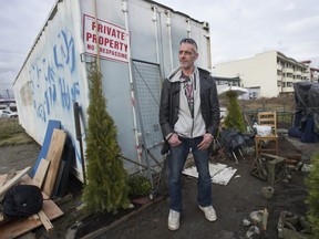 Jay Post outside the disused container he has taken over for a home.