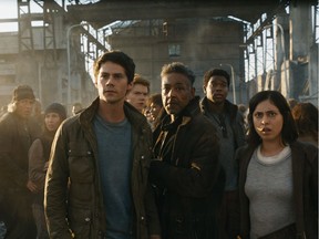 Actors Dylan O'Brien, Giancarlo Esposito and Rosa Salazar (left to right, in the foreground) in a scene from Maze Runner: The Death Cure — the highest grossing film of the weekend on its opening weekend.