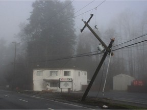 A Surrey RCMP vehicle crashed into a power pole and a business on Fraser Highway while driving in heavy fog on Sunday morning. According to police, the vehicle's driver lost control after his real left wheel got caught in a manhole that's cover had been dislodged.