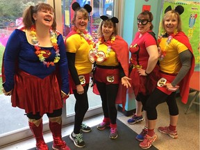 The Langley Sun Run InTraining clinic, led by coordinator Sandra Jongs Sayer, second from right, held a surprise super heroes run to mark Gord Kurenoff's birthday last year. From left: Michele Anderson, Brenda Kerslake, Debbie Elliott and Yvonne Repin also enjoyed the costumed exercise.