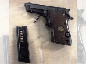 One man is charged after allegedly being in possession of this semi-automatic pistol following a routine traffic stop.