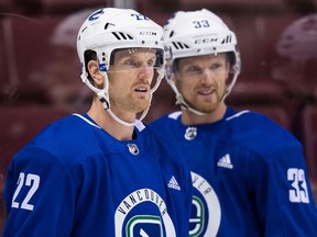 Vancouver Canucks' Daniel Sedin, left, and his twin brother Henrik Sedin.