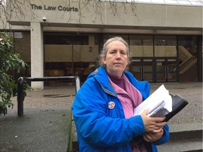 Roslyn Cassells stands outside B.C. Supreme Court in New Westminster on Jan. 8, where she has asked a judge for an injunction to stop the construction of a road through Hawthorne Park. She's arguing it's critical habitat for vulnerable species.