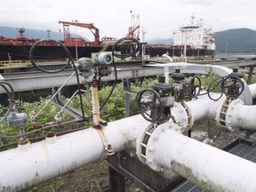 A ship receives its' load of oil from the Kinder Morgan Trans Mountain Expansion Project's Westeridge loading dock in Burnaby, British Columbia, on June 4, 2015. Mining and upstream oil and gas production are the biggest single contributor to B.C.'s carbon emssions annually, at 7.2 million tonnes, according to the province’s categories. Next are emissions from heavy-duty diesel vehicles at 6.92 million tonnes.