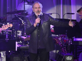 This Feb. 11, 2017, file photo shows Neil Diamond performing at the Clive Davis and The Recording Academy Pre-Grammy Gala at the Beverly Hilton Hotel in Beverly Hills, Calif. (Chris Pizzello/Invision/AP)