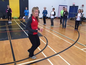 Lynn Kanuka of SportMedBC is no stranger to giving Vancouver Sun Run InTraining leaders a demonstration on proper shuffling.